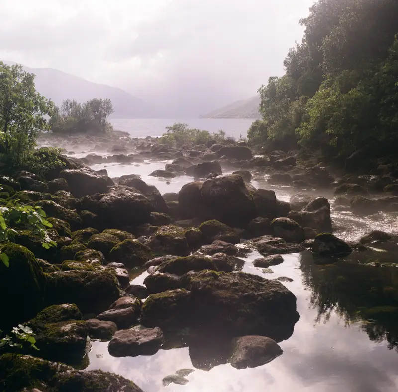 Mist appears where the cold river meets the warm bay